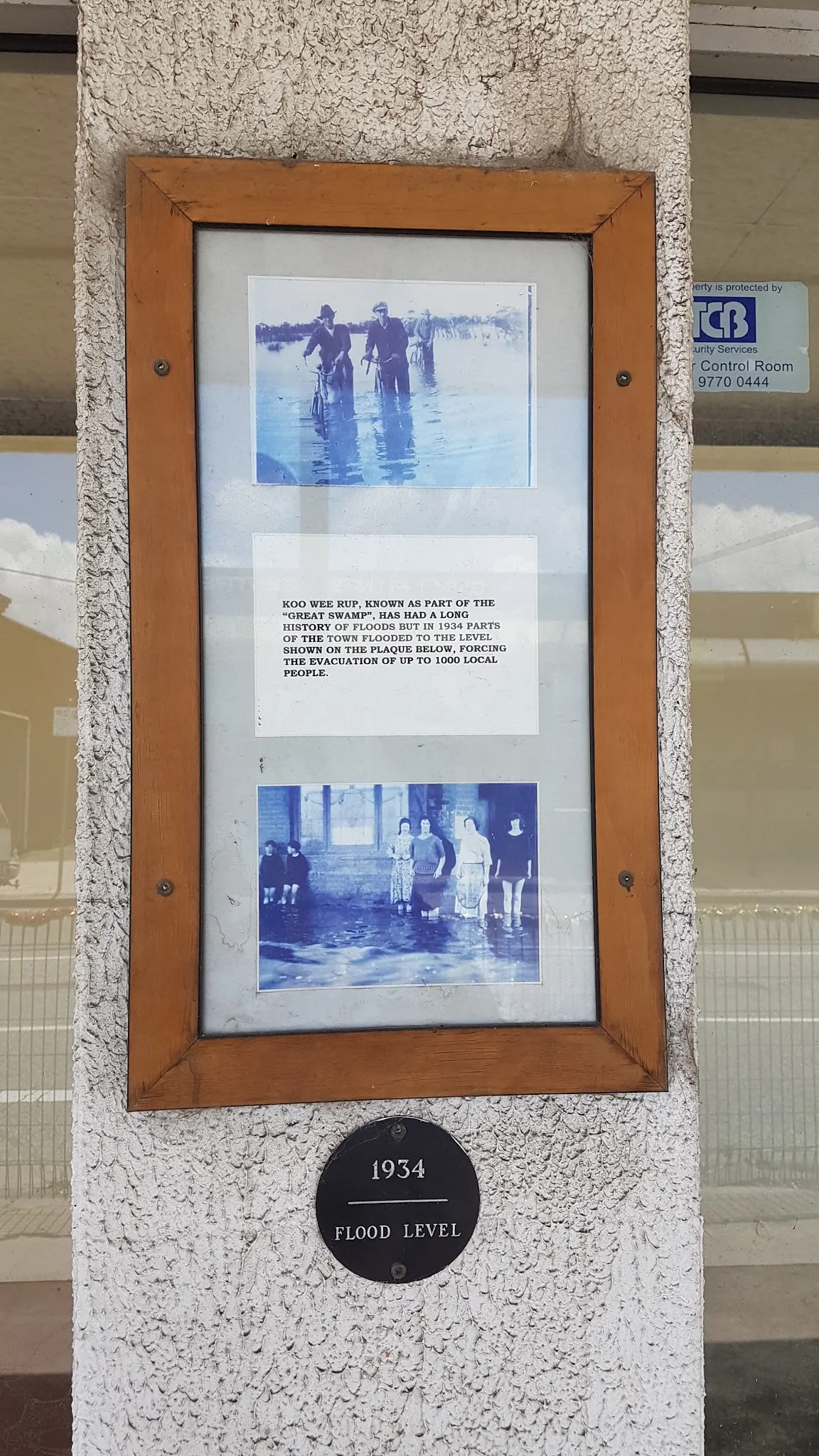 Historic 1934 flood level plaque and photographs on the Koo Wee Rup shopfront